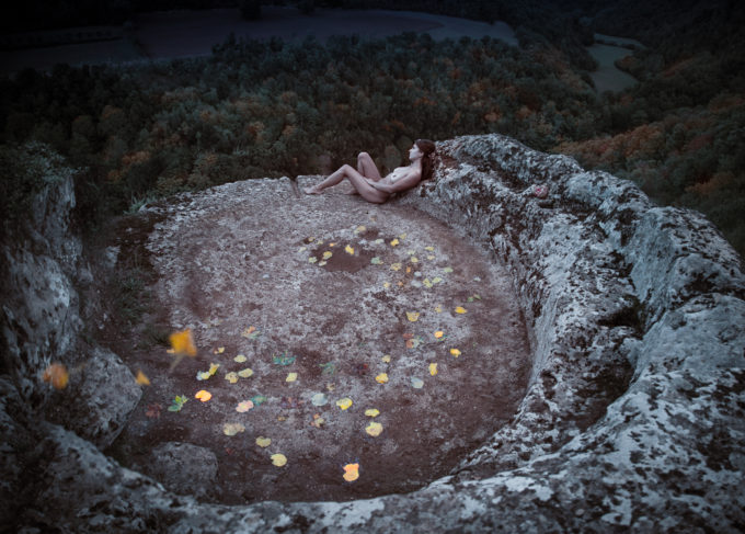 girl in a vortex of leaves