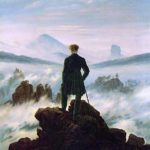 man standing on a cliff