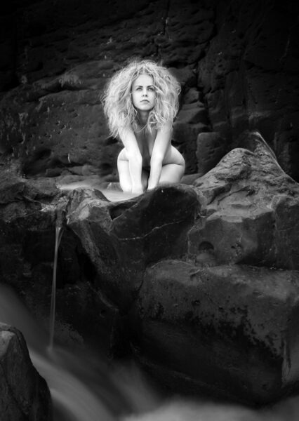 naked woman in sphinx pose